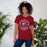 Woman wearing Tompkins High School Falcons Cardinal Red Premium Unisex T-shirt 206