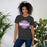 A woman wearing Klein Cain High School Hurricanes Premium Dark Grey Heather T-shirt 11