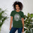 Woman wearing Reagan High School Rattlers Dark Green Premium Unisex T-shirt 212