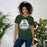 Woman wearing Reagan High School Rattlers Dark Green Premium Unisex T-shirt 219