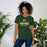 Woman wearing Klein Forest High School Golden Eagles Premium Forest Green Unisex T-shirt 202