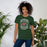 Woman wearing The Woodlands High School Highlanders Forest Green Premium Unisex T-shirt 207