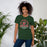 Woman wearing The Woodlands High School Highlanders Forest Green Premium Unisex T-shirt 206