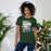 Woman wearing Reagan High School Rattlers Forest Green Premium Unisex T-shirt 232