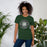 Woman wearing Reagan High School Rattlers Forest Green Premium Unisex T-shirt 224