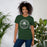Woman wearing Reagan High School Rattlers Forest Green Premium Unisex T-shirt 215