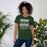 Woman wearing Reagan High School Rattlers Forest Green Premium Unisex T-shirt 237