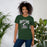 Woman wearing Reagan High School Rattlers Forest Green Premium Unisex T-shirt 213