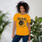 Woman wearing a Klein Oak High School Panthers Premium Gold Unisex T-shirt 208