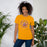 Woman wearing Jersey Village High School Falcons Gold Premium Unisex T-shirt 214