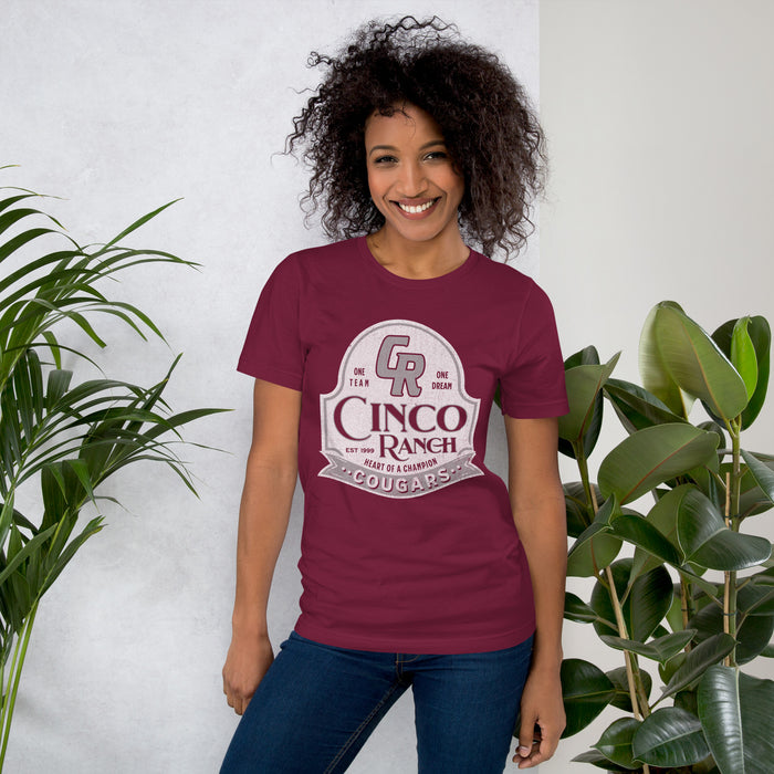 Woman wearing a Cinco Ranch High School Cougars Premium Maroon Unisex T-shirt 207