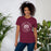 Woman wearing a Cinco Ranch High School Cougars Premium Maroon Unisex T-shirt 217