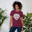 Woman wearing Lewisville High School Farmers Maroon Premium Unisex T-shirt 221