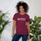 Woman wearing Lewisville High School Farmers Maroon Premium Unisex T-shirt 200
