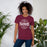 Woman wearing Lewisville High School Farmers Maroon Premium Unisex T-shirt 218