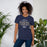 Woman wearing a Klein Collins High School Tigers Premium Navy T-shirt 40