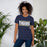 Woman wearing a Klein Collins High School Tigers Premium Navy T-shirt 98