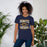 Woman wearing Nimitz High School Cougars Navy Blue Premium Unisex T-shirt 230