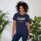 Woman wearing Nimitz High School Cougars Navy Blue Premium Unisex T-shirt 226
