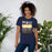 Woman wearing Nimitz High School Cougars Navy Blue Premium Unisex T-shirt 240