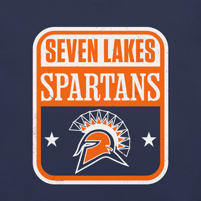 A rectangular graphic with rounded corners reading 'SEVEN LAKES SPARTANS' in orange and white text, with an orange and white Spartan helmet logo and two white stars on a dark navy background. The design appears distressed and is centered on a dark navy backdrop. Seven Lakes High School Spartans Navy Blue Premium Unisex T-shirt 001