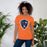 Woman wearing Seven Lakes High School Spartans Orange Premium Unisex T-shirt 225