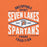 A graphic print on an orange fabric background featuring the text 'SEVEN LAKES SPARTANS' in large white letters, with 'UNSTOPPABLE SPIRIT' above and 'PROUD TRADITION' below. A central diamond logo contains a Spartan helmet and the words 'GAME READY'. Seven Lakes High School Spartans Orange Premium Unisex T-shirt 210