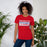 Woman wearing Sam Houston High School Texans Red Premium Unisex T-shirt 031