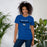 Woman wearing New Caney High School Eagles Royal Blue Premium Unisex T-shirt 017
