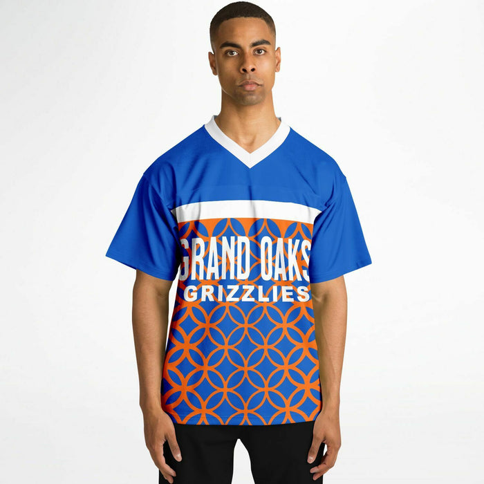 Black man wearing Grand Oaks Grizzlies football Jersey