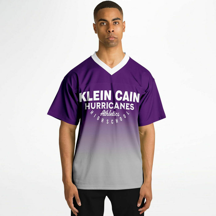 Black man wearing Klein Cain Hurricanes football Jersey