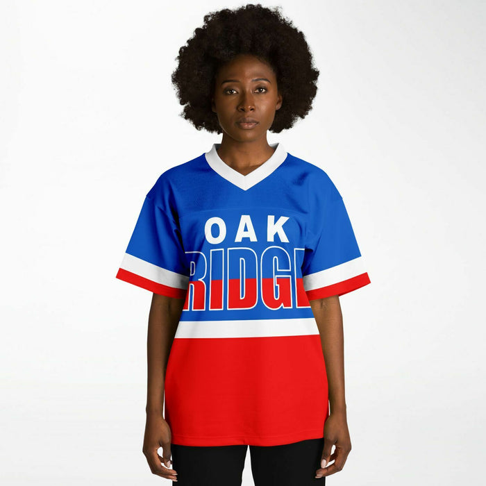 Black woman wearing Oak Ridge War Eagles High School football Jersey