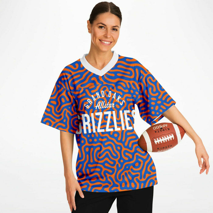 Women wearing Grand Oaks Grizzlies football jersey