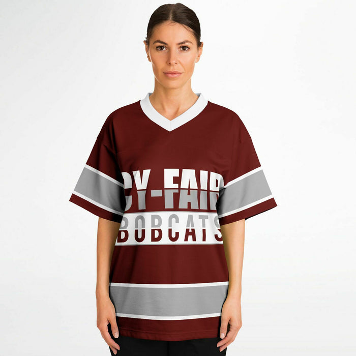 Women wearing Cy-Fair Bobcats football jersey