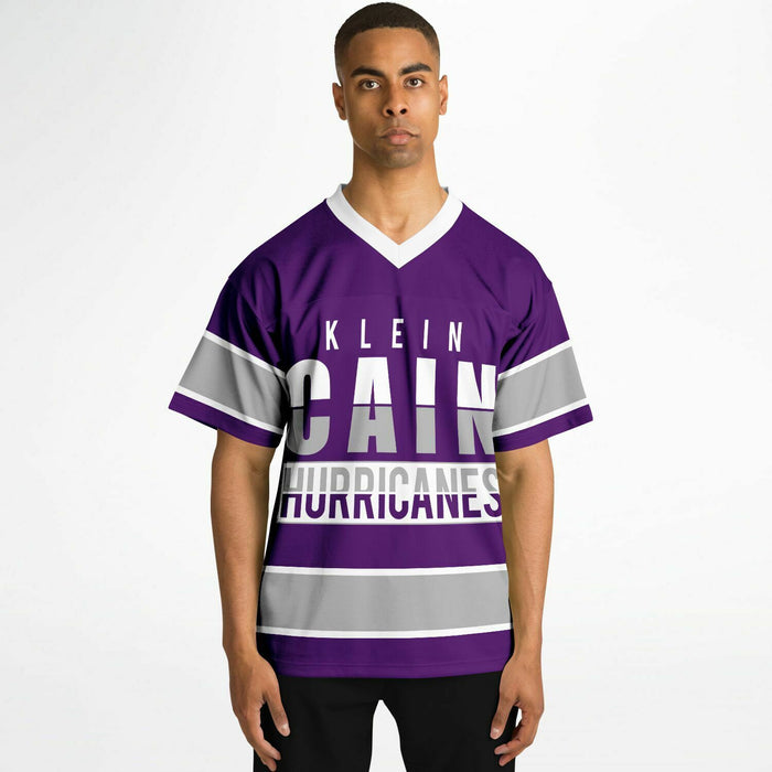 Black man wearing Klein Cain Hurricanes football Jersey
