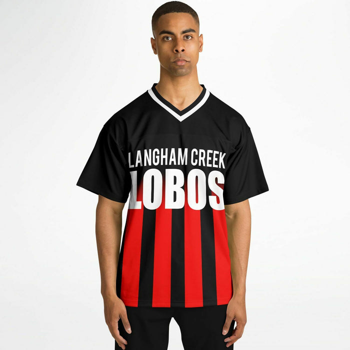 Black man wearing Langham Creek Lobos football Jersey