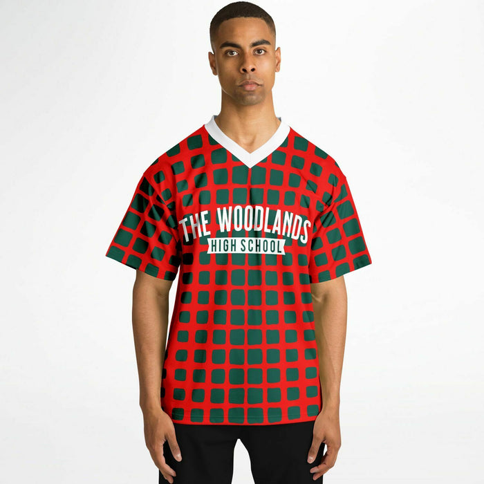 Black man wearing The Woodlands Highlanders High School football Jersey