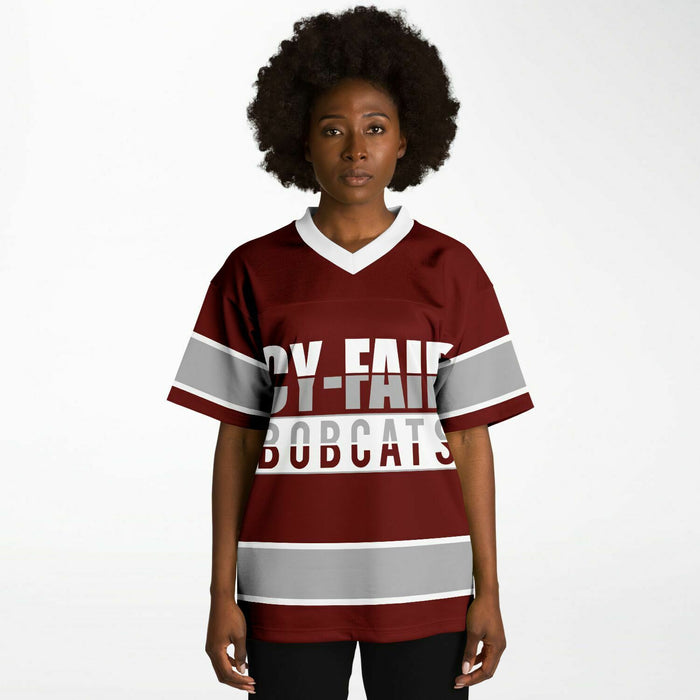 Black woman wearing Cy-Fair Bobcats football Jersey