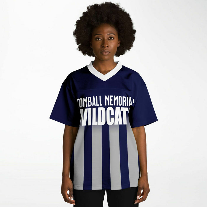 Black woman wearing Tomball Memorial Wildcats High School football Jersey