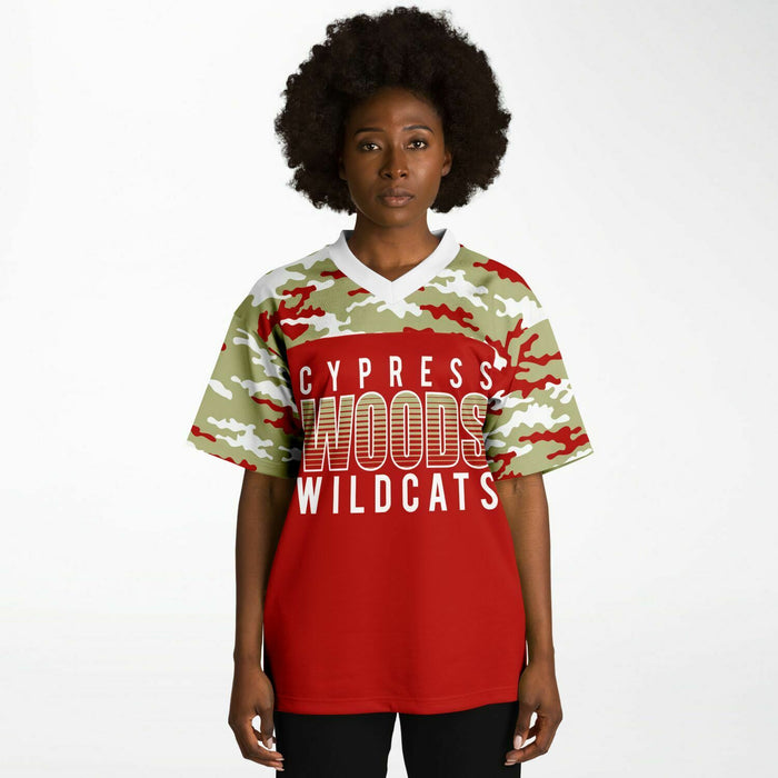 Black woman wearing Cypress Woods Wildcats football Jersey 08