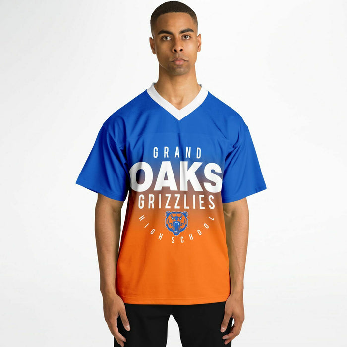 Black man wearing Grand Oaks Grizzlies football Jersey