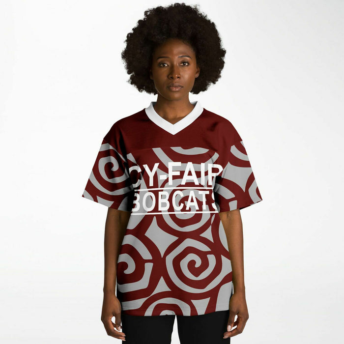 Black woman wearing Cy-Fair Bobcats football Jersey