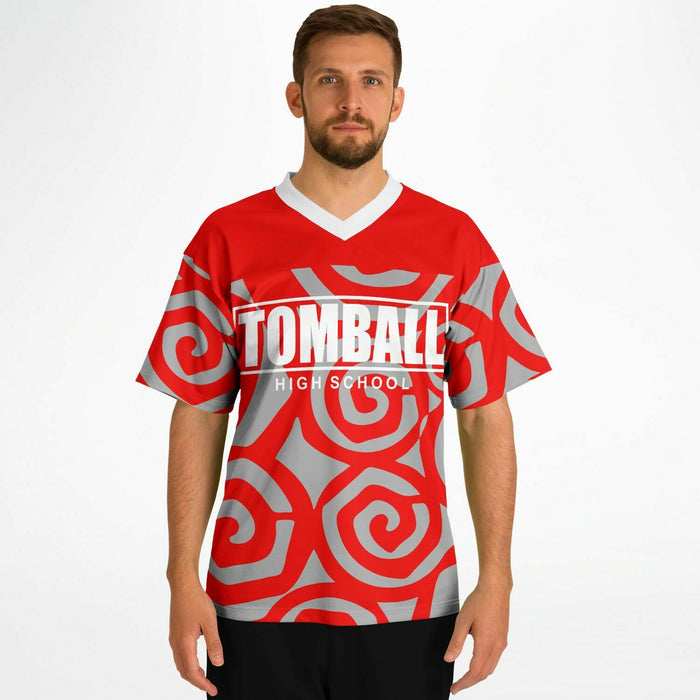 Man wearing Tomball Cougars High School football jersey