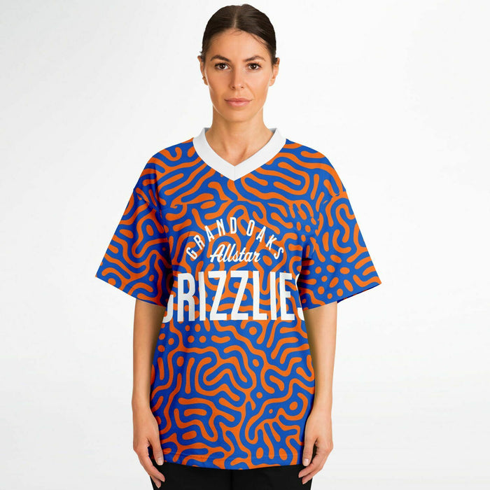 Women wearing Grand Oaks Grizzlies football jersey