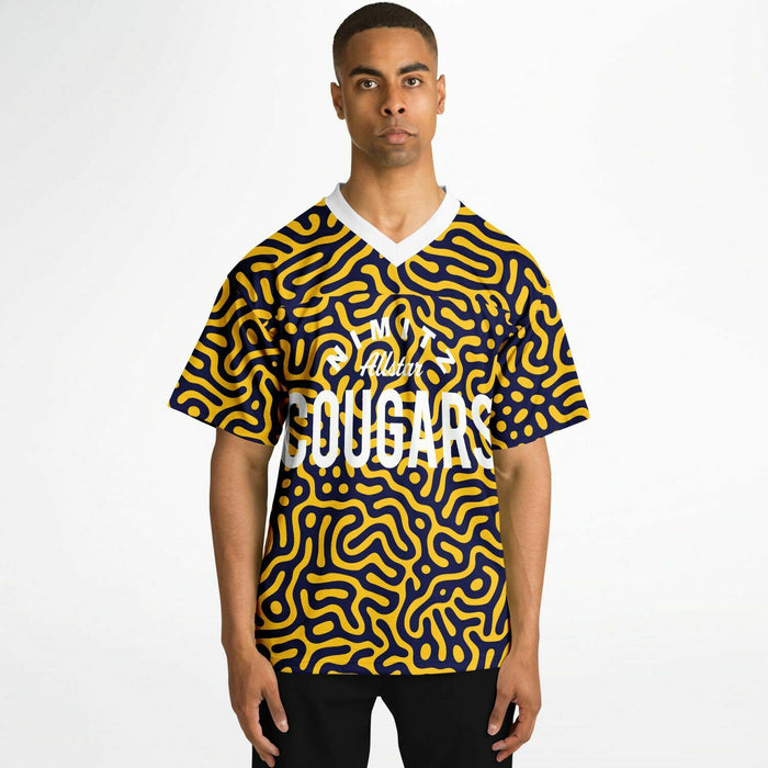 Black man wearing Nimitz Cougars High School football Jersey