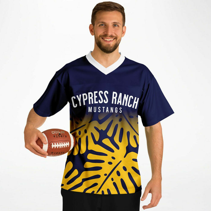 Man wearing Cypress Ranch Mustangs football jersey