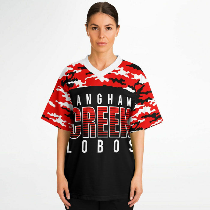 Women wearing Langham Creek Lobos football jersey