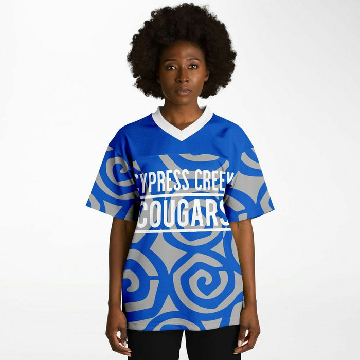 Black woman wearing Cypress Creek Cougars football Jersey