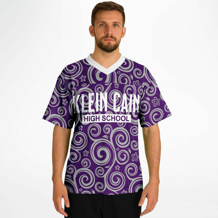 Man wearing Klein Cain Hurricanes football jersey