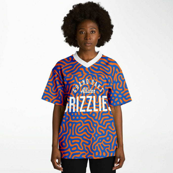 Black woman wearing Grand Oaks Grizzlies football Jersey